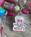 Orange Nerves RCT Endo Pen from Teeth Obsessed, a dental pen and holder for root canal procedures.