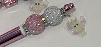 Pink and white Tooth Fairy Unicorn Bubble Pens from Teeth Obsessed, featuring playful unicorn and tooth-themed designs.
