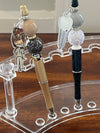 Teeth Obsessed dental pens and holders with Top Gum sunflower design, featuring denture and implant-themed illustrations.