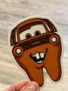 Blue car character dental tooth sticker from Teeth Obsessed, fun dental-themed sticker for kids' teeth decor.