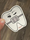 Blue orthodontic dental braces sticker from Teeth Obsessed, designed as a fun and decorative dental sticker for braces.
