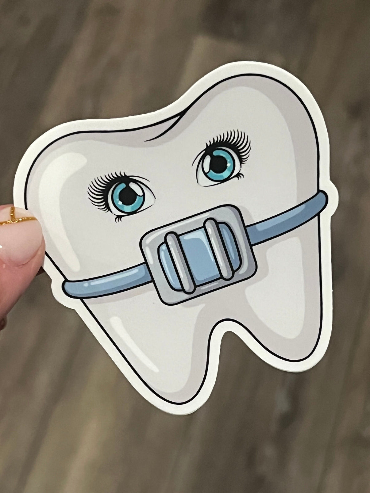 Blue orthodontic dental braces sticker from Teeth Obsessed, featuring fun dental-themed design for orthodontic patients.