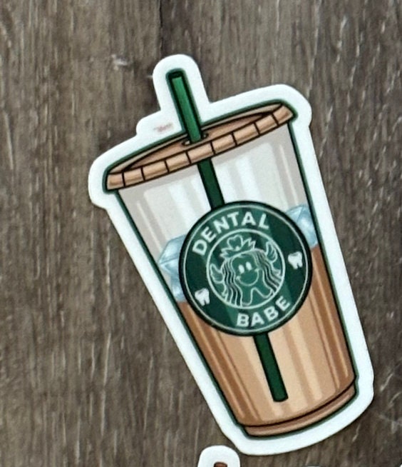 Dental stickers featuring tooth and dental-themed designs on coffee cups, by Teeth Obsessed.