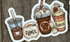 Dental stickers featuring teeth designs from Teeth Obsessed, shown on a coffee cup in the image.