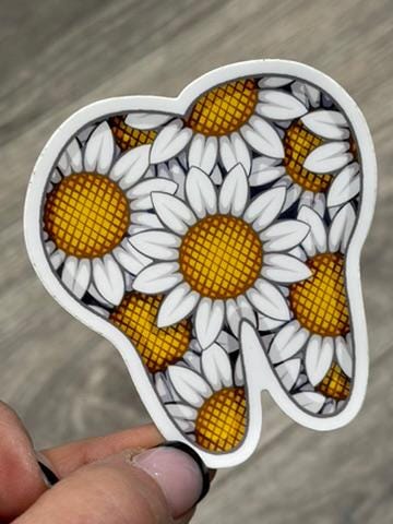 Daisy Tooth Sticker from Teeth Obsessed dental stickers featuring a cute cartoon tooth with a daisy design.