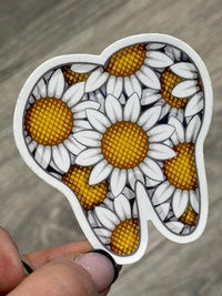Daisy Tooth Sticker from Teeth Obsessed dental stickers featuring a cute cartoon tooth with a daisy design.