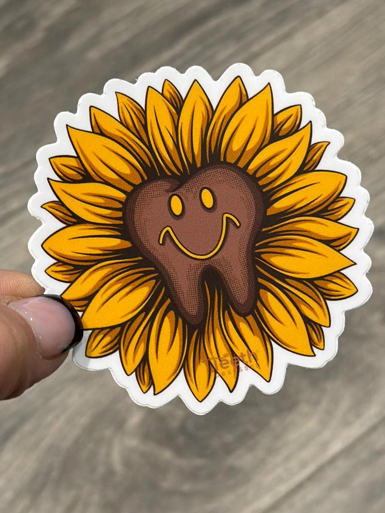Sunflower dental sticker from Teeth Obsessed featuring a bright sunflower design on a tooth-shaped sticker.