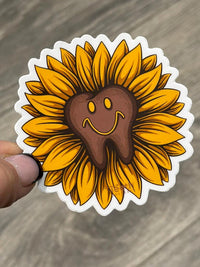 Sunflower dental sticker from Teeth Obsessed featuring a bright sunflower design on a tooth-shaped sticker.