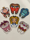 Teeth Obsessed Wonderland Dental Stickers featuring colorful rabbit and wonderland-themed designs for kids' dental fun.