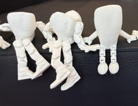 Teeth Obsessed Flossy Friends™ Anterior doll, a colorful dental-themed figure from the dolls and figures collection.