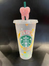 Teeth Obsessed Purple Dental Babe Rose Fold Starbucks Gold Cup with Peach and Multi-colored details and decorative topper.