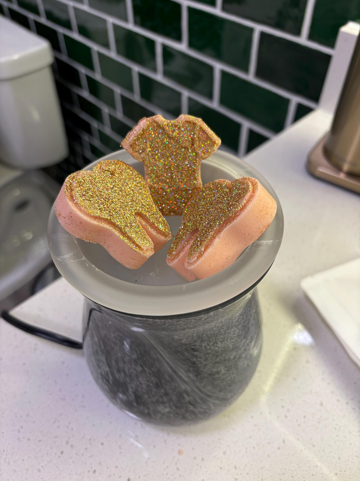 Rose gold tooth and scrub top wax melts from Teeth Obsessed, freshies, vents, and tart with purple and light colors.