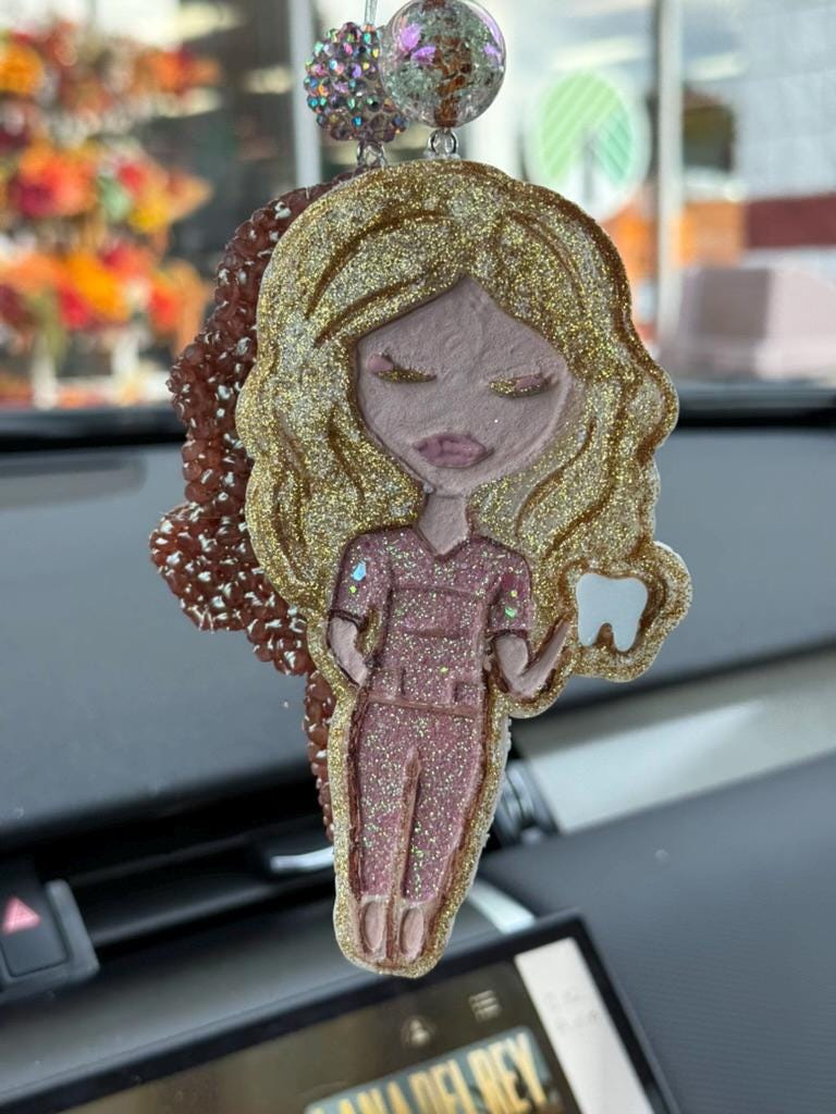 Pink and gold dental team member car freshener from Teeth Obsessed, featuring blonde and blueberry scents, designed for vents and tarts.