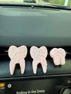Pink Tooth Car Fresheners from Teeth Obsessed, vent tart freshies with blueberry scent, designed to freshen car interiors.