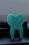 Teeth Obsessed turquoise blueberry tooth freshener and vent clips, small and regular size, for freshening car air vents.
