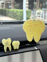 Teeth Obsessed yellow blueberry car freshener and vent clip, freshies and tart for vehicle air freshening.