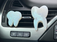 Teeth Obsessed Tooth Car Freshie vents tart with small and regular rose-shaped freshies for vehicle air freshening.