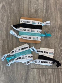 Teeth Obsessed Scrub Life dental hair ties and clips, colorful hair accessories for dental professionals or everyday use.
