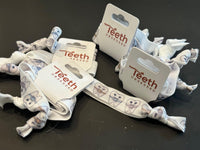 Orthodontic Hair Ties and Clips by Teeth Obsessed, designed to gently hold hair without damaging braces or orthodontic appliances.