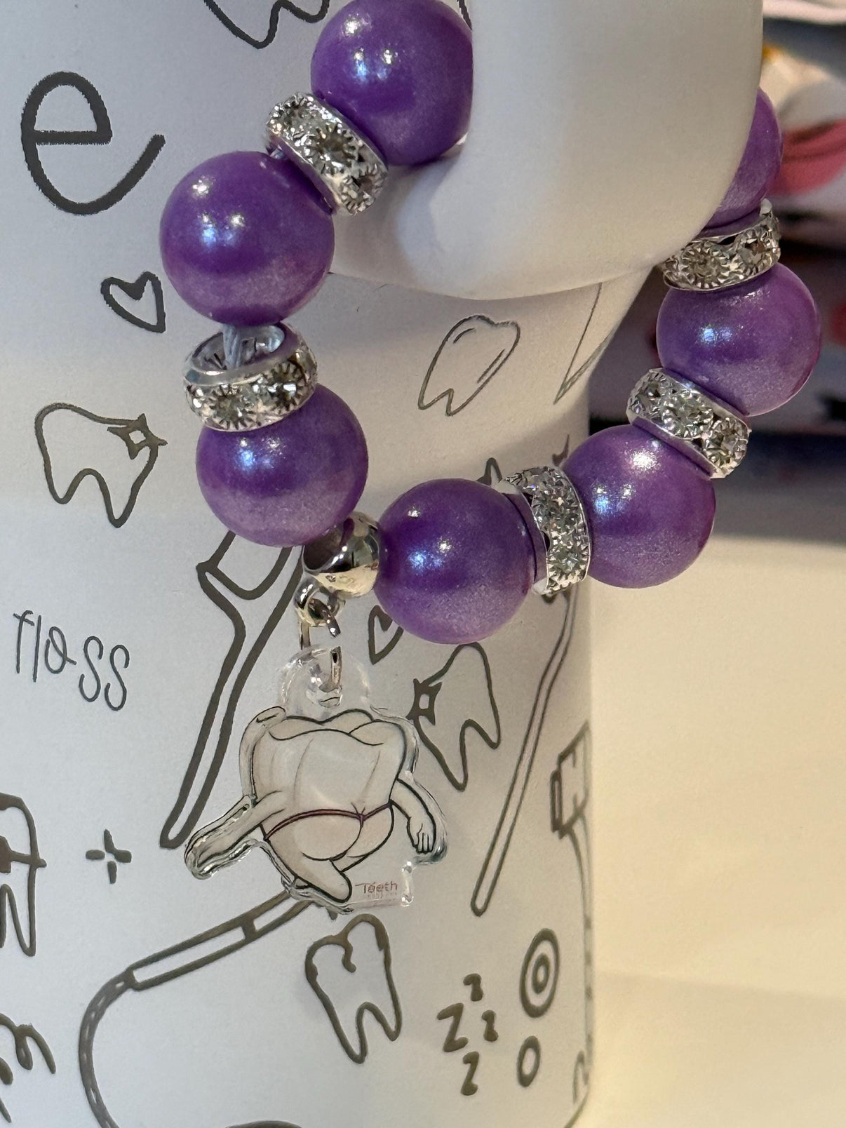 Purple Mrs Flossy Tumbler Charms by Teeth Obsessed, featuring playful dental-themed designs on Mrs Flossy cup charms.
