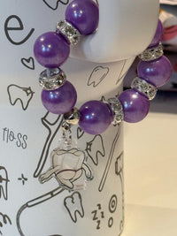 Purple Mrs Flossy Tumbler Charms by Teeth Obsessed, featuring playful dental-themed designs on Mrs Flossy cup charms.