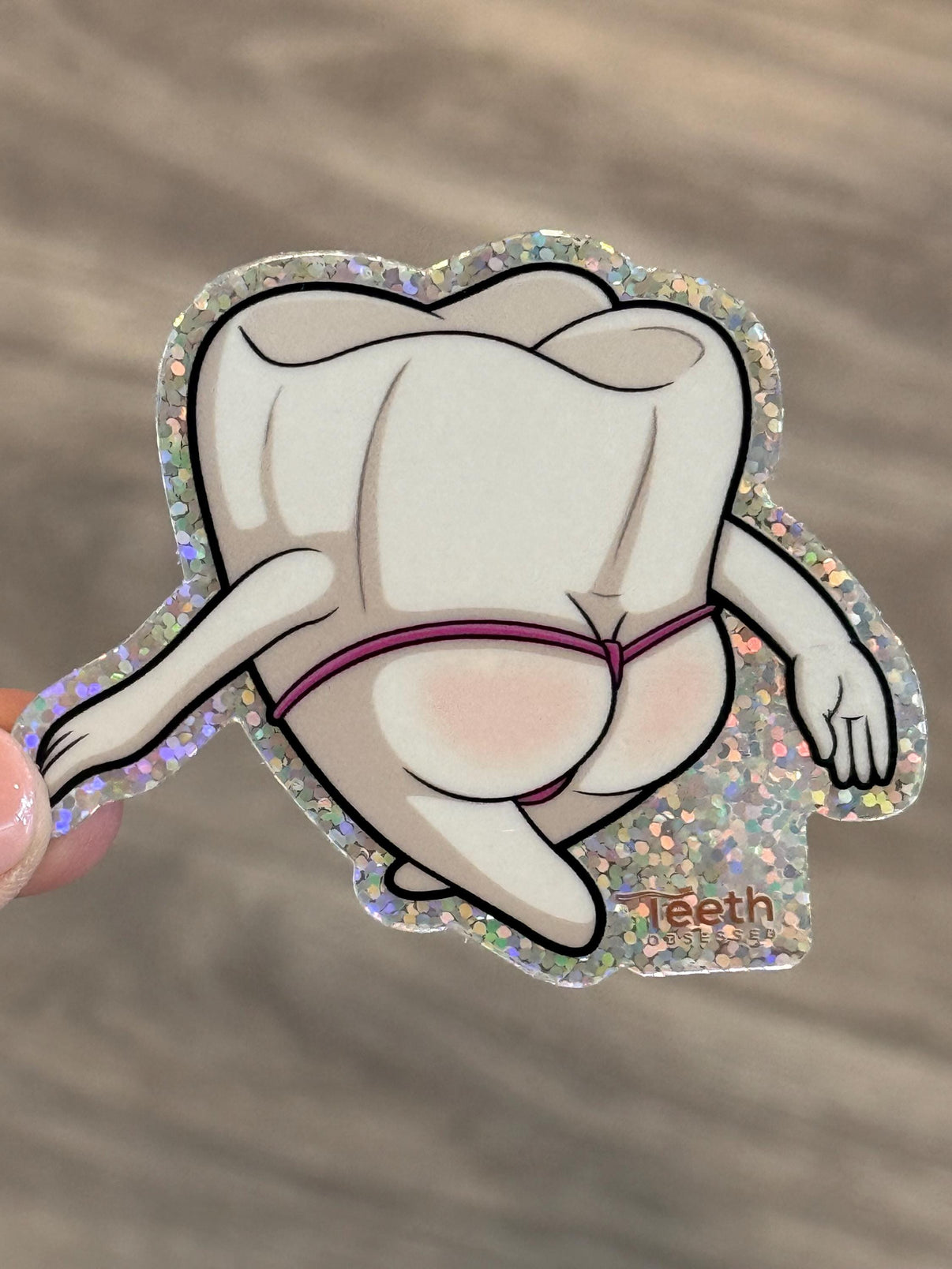 Mrs Flossy Glitter Tooth Sticker from Teeth Obsessed featuring shiny glitter design on a playful tooth-shaped sticker
