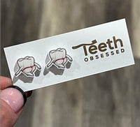 Mrs Flossy Tooth Earrings by Teeth Obsessed featuring playful tooth-shaped jewelry on silver hooks.
