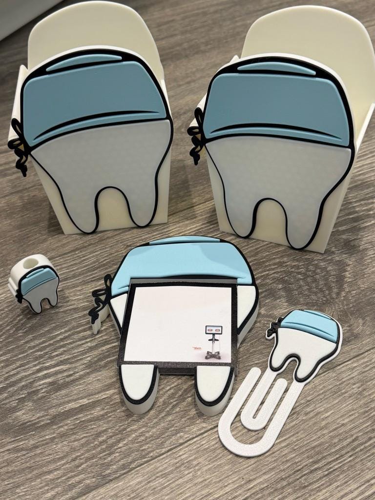 Teeth Obsessed 3D Scrub Tooth magnet notepad holder with pen, paper clip, and tooth topper for desk organization.