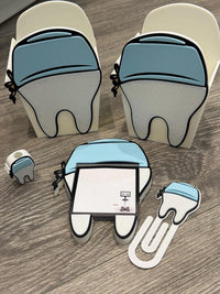 Teeth Obsessed 3D Scrub Tooth magnet notepad holder with pen, paper clip, and tooth topper for desk organization.
