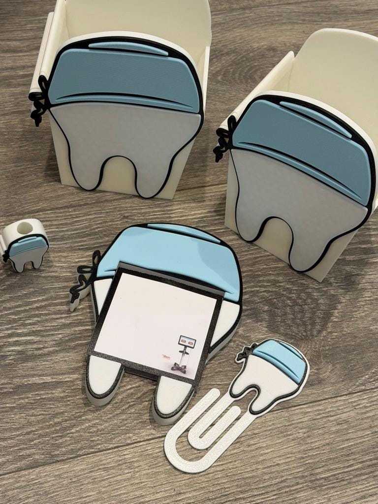 Teeth Obsessed 3D Scrub Tooth magnet notepad holder with pen holder, paper clip, and tooth topper for desk organization.