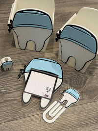 Teeth Obsessed 3D Scrub Tooth magnet notepad holder with pen holder, paper clip, and tooth topper for desk organization.