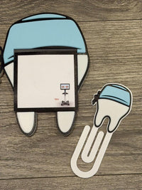 Teeth Obsessed magnet notepad holder featuring a white scrub cap design with pen holder, notepad, and paperclip accessories.