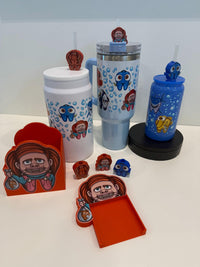 Teeth Obsessed Nautica Tooth Topper, white tumbler, mug, pen holder, and notepad holder with teeth-themed design.