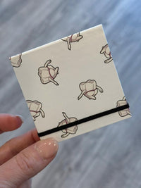 Mrs Flossy Dental Notepad with notes and magnet from Teeth Obsessed, featuring playful dental-themed illustrations.