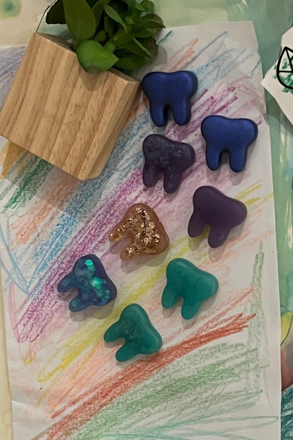 Set of three purple acrylic tooth-shaped magnets for dental office decor, featuring notes and magnets from Teeth Obsessed.