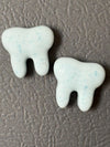 Set of three turquoise resin tooth magnets for dental office decor, featuring Teeth Obsessed branding.