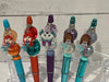 Blue Mermaid Tooth Pens by Teeth Obsessed, featuring whimsical mermaid designs on pens and holders for dental-themed writing accessories.