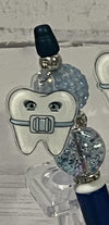 Teeth Obsessed gold Ortho Pubble pens with matching holders, designed for dental professionals and orthodontic use.