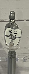 Teeth Obsessed gold Ortho Pubble pens with matching holders, designed for orthodontic professionals and dental offices.