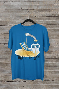 White "That's The Spot" curing light tooth shirt and pin by Teeth Obsessed, featuring dental-themed design and playful style.
