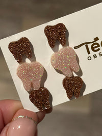 Rose gold dental earrings featuring Valentine-themed design from Teeth Obsessed, showcasing detailed tooth-shaped jewelry.